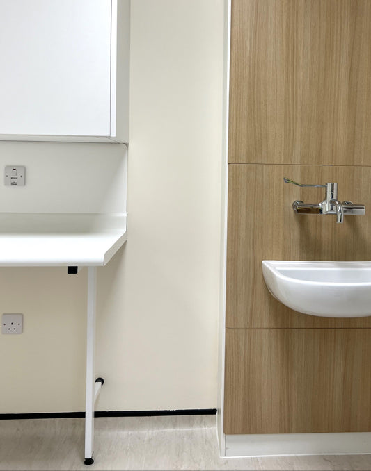 HTM 63 Worktop in NHS Clinical Room supported by cantilever leg