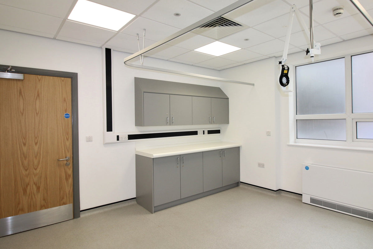 Laminate worktop with integral upstand on a run of clinical cupboards