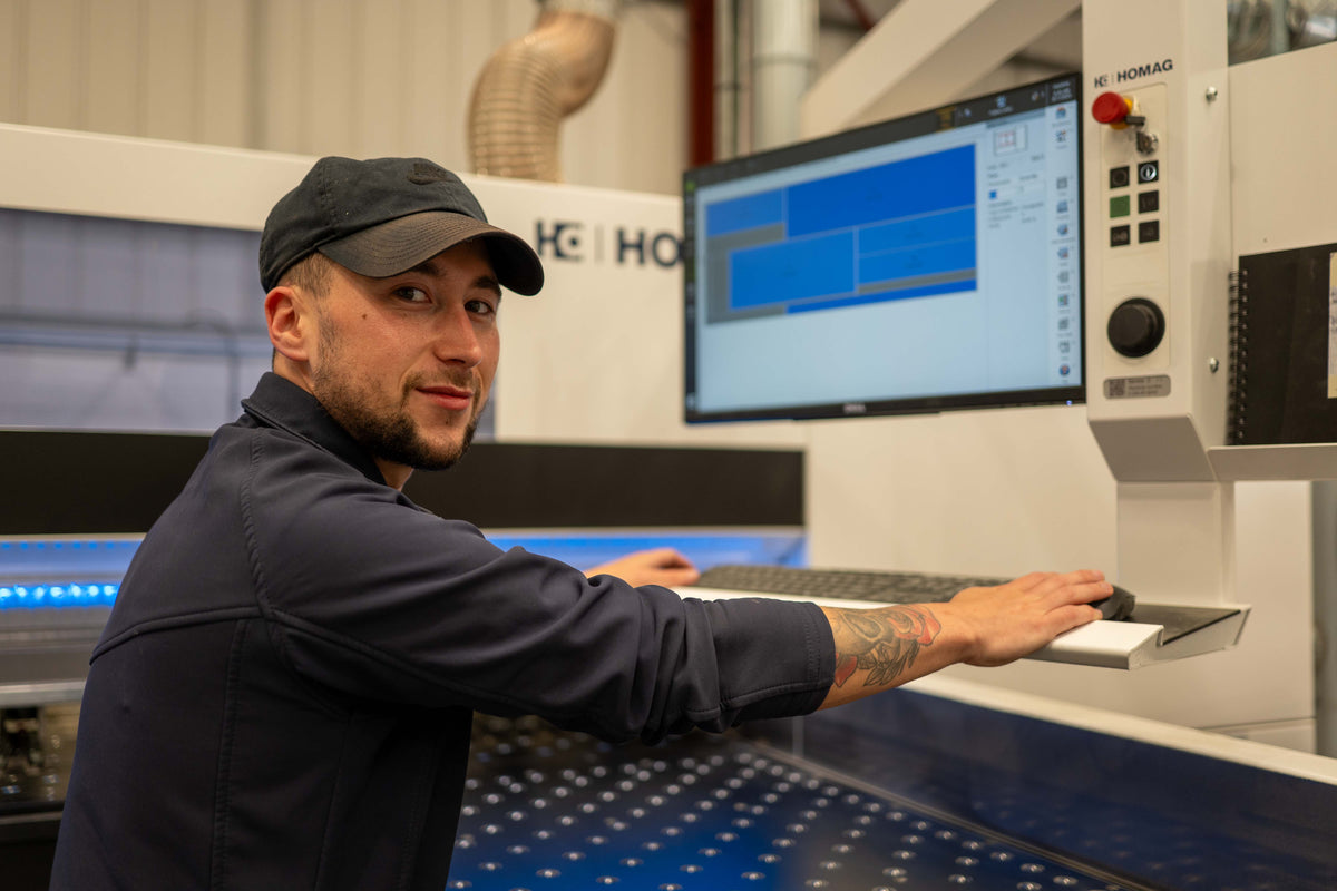 Bridgewater Direct operator at the Homag beam saw cutting MFC sheets in the Bolton workshop
