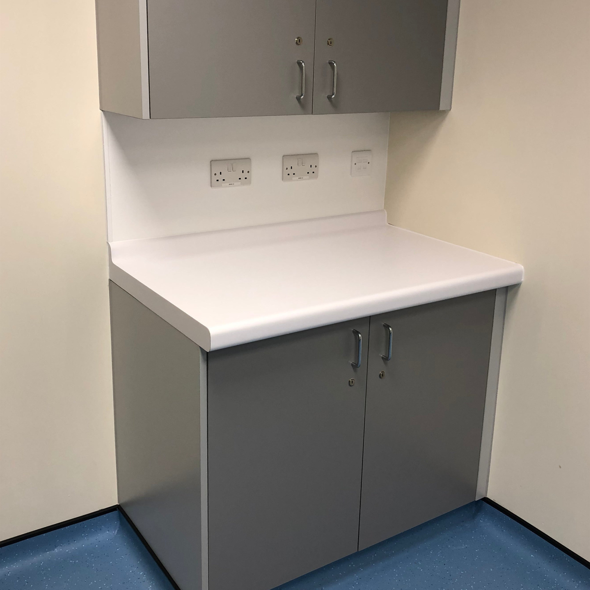 Laminate worktop with integral coved upstand fitted on cabinets