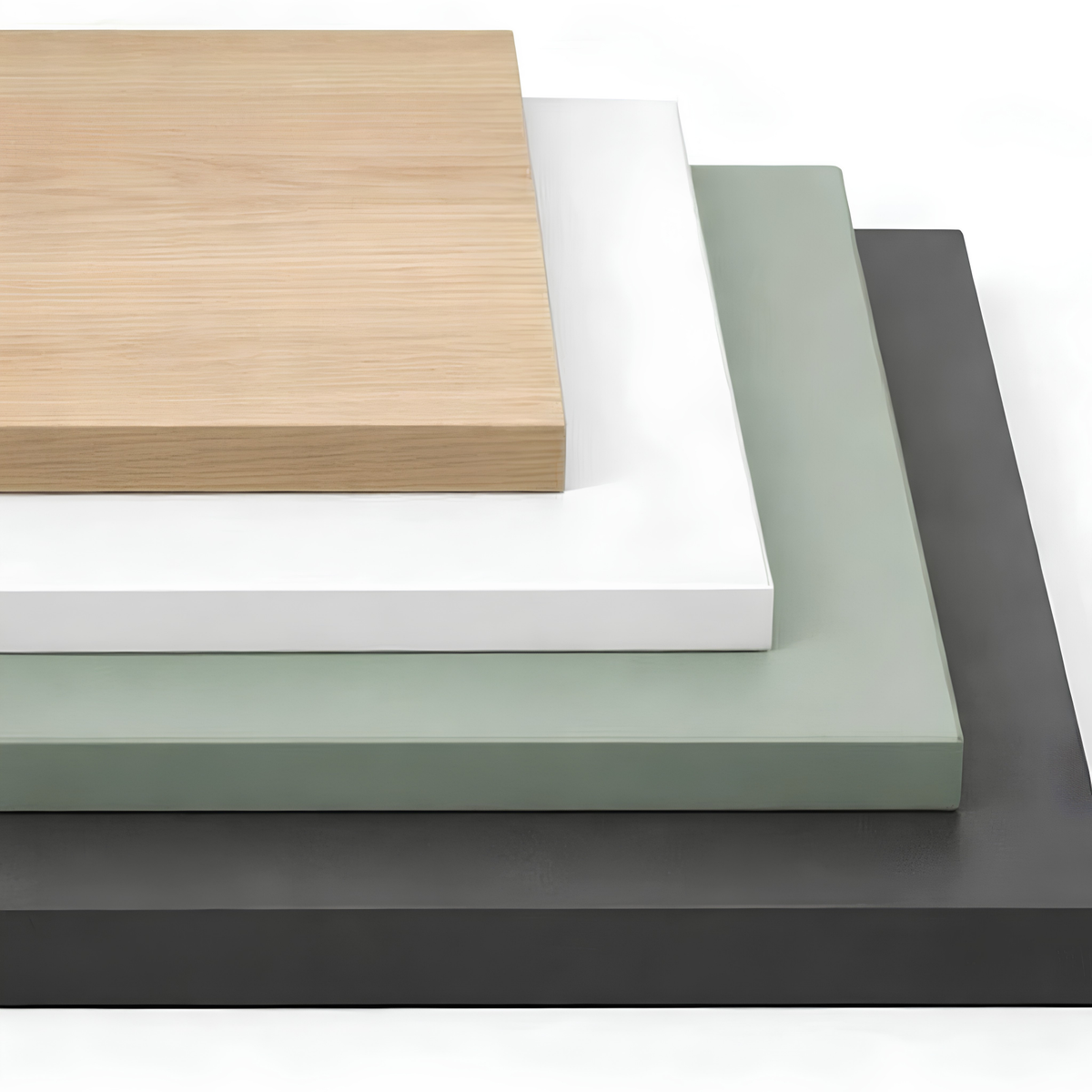 Four stacked rectangular MFC samples in different colors: a light natural wood top, white, sage green, and dark charcoal gray, shown on a clean white background.